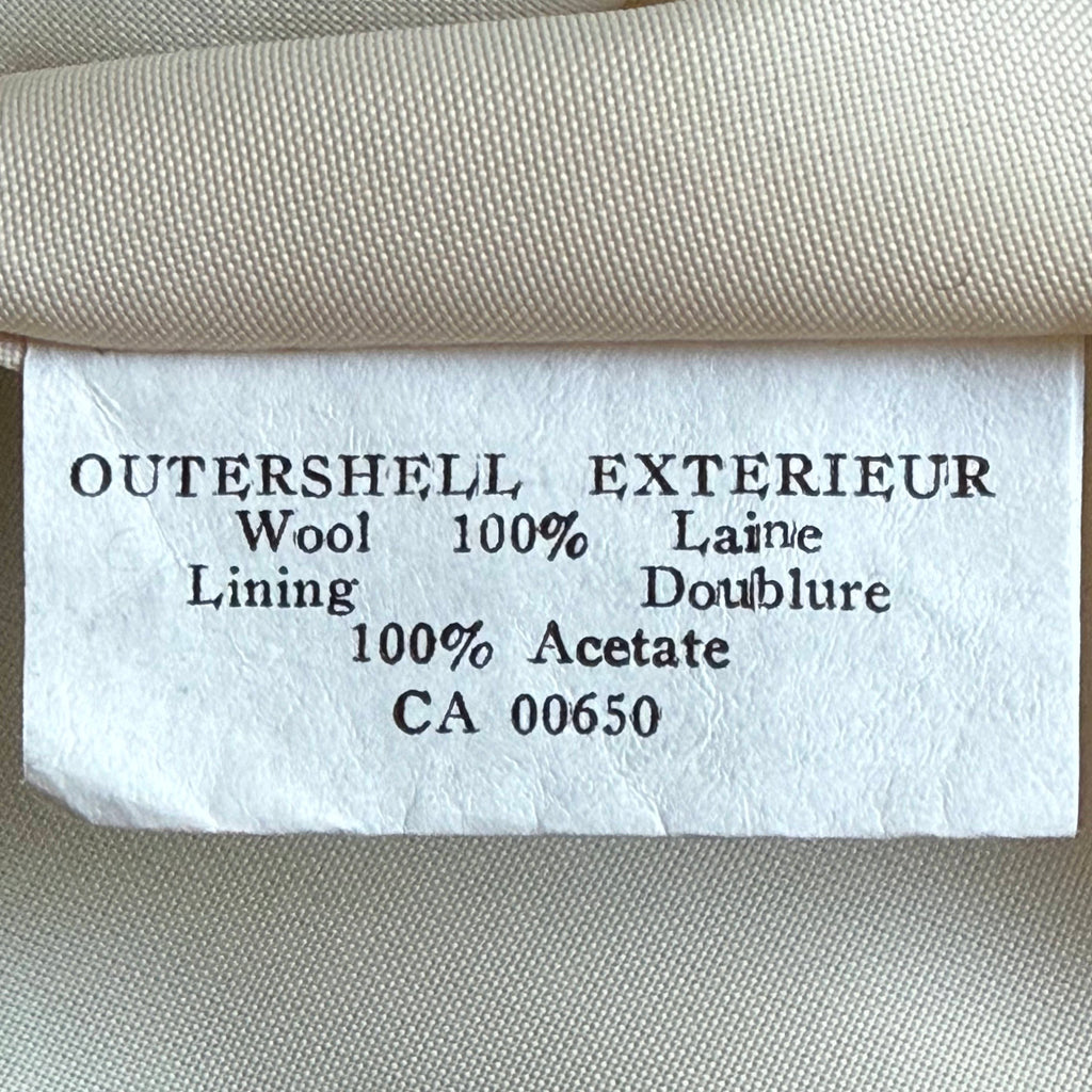 Content label on vintage 1970s green wool spring coat