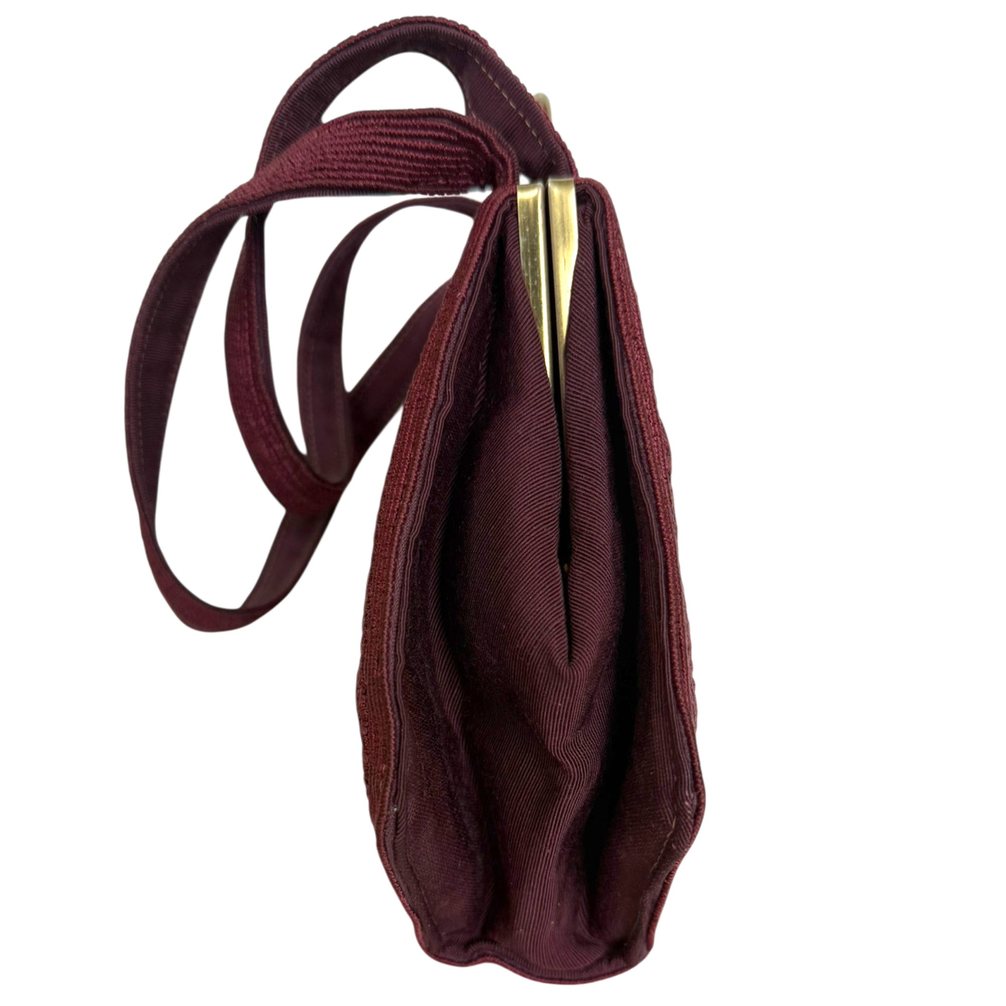 vintage 1940s maroon cordé handbag viewed from the side