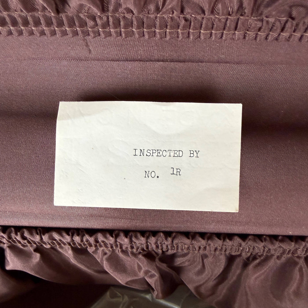 inspection paper in vintage suitcase