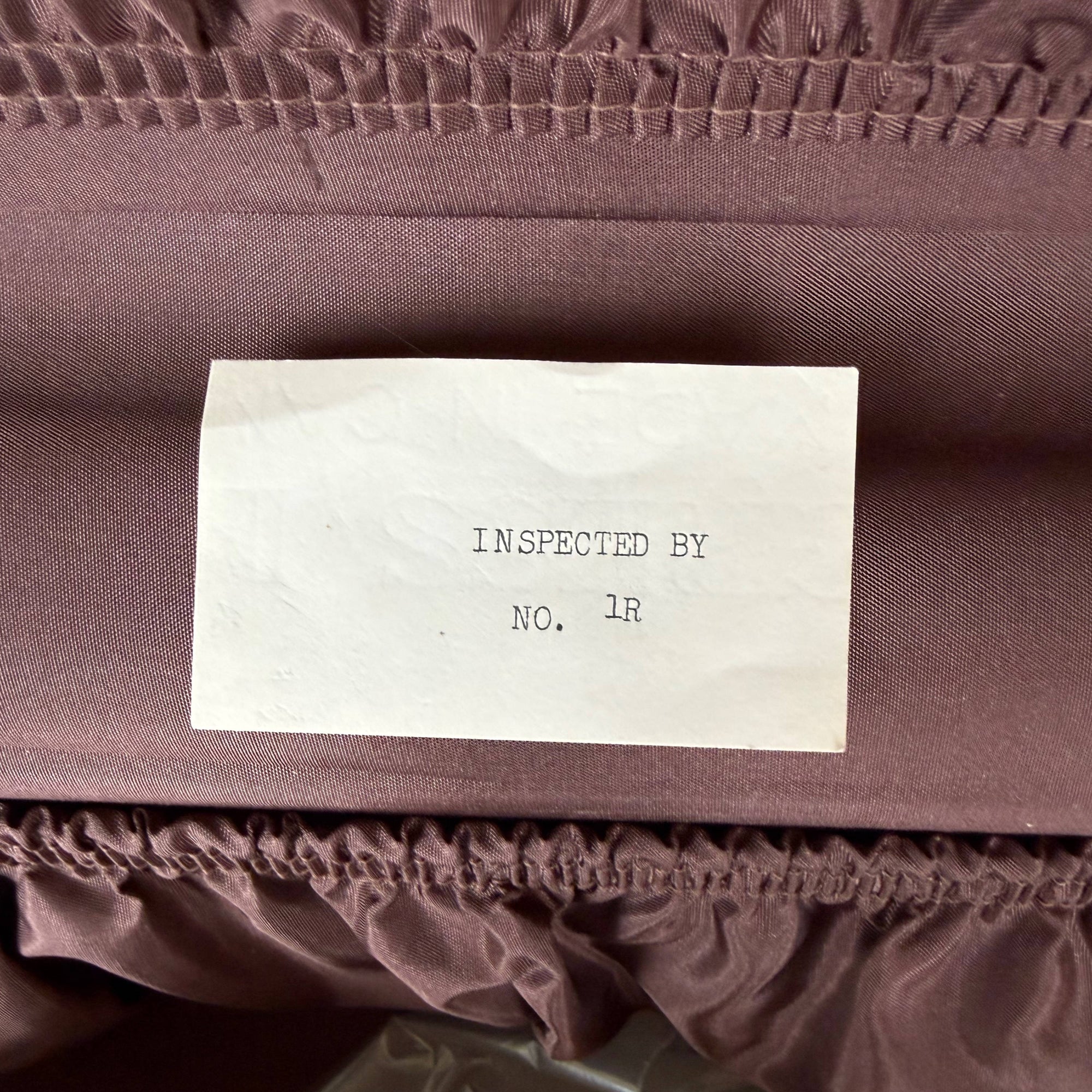 inspection paper in vintage suitcase