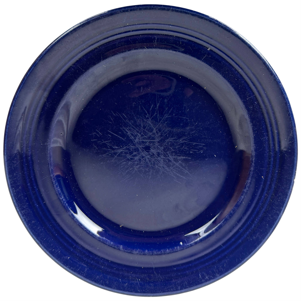 Medicine Hat Potteries cobalt blue plate showing surface wear