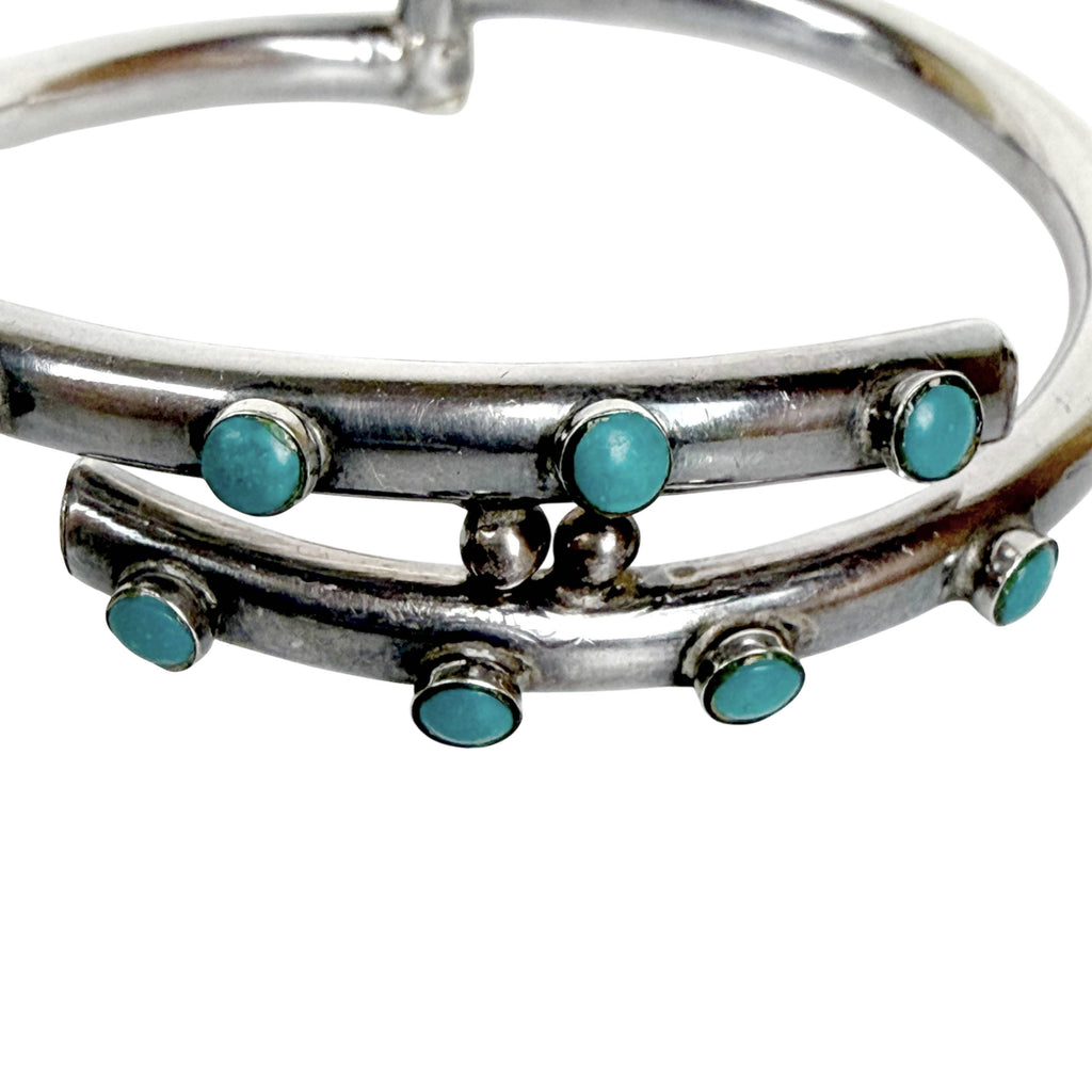 Mid-century Mexican silver cuff bracelet with eight turquoise cabochons