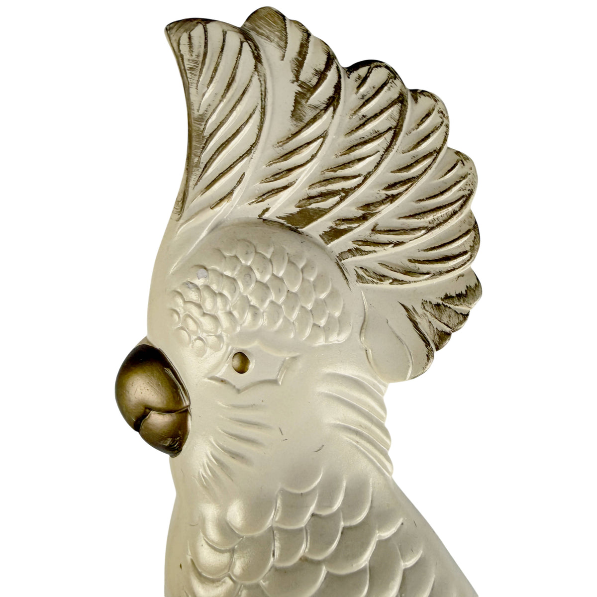Close-up of vintage Miller Studio chalkware cockatoo showing sculpted feather crest, curved gold beak and cream pearlescent finish