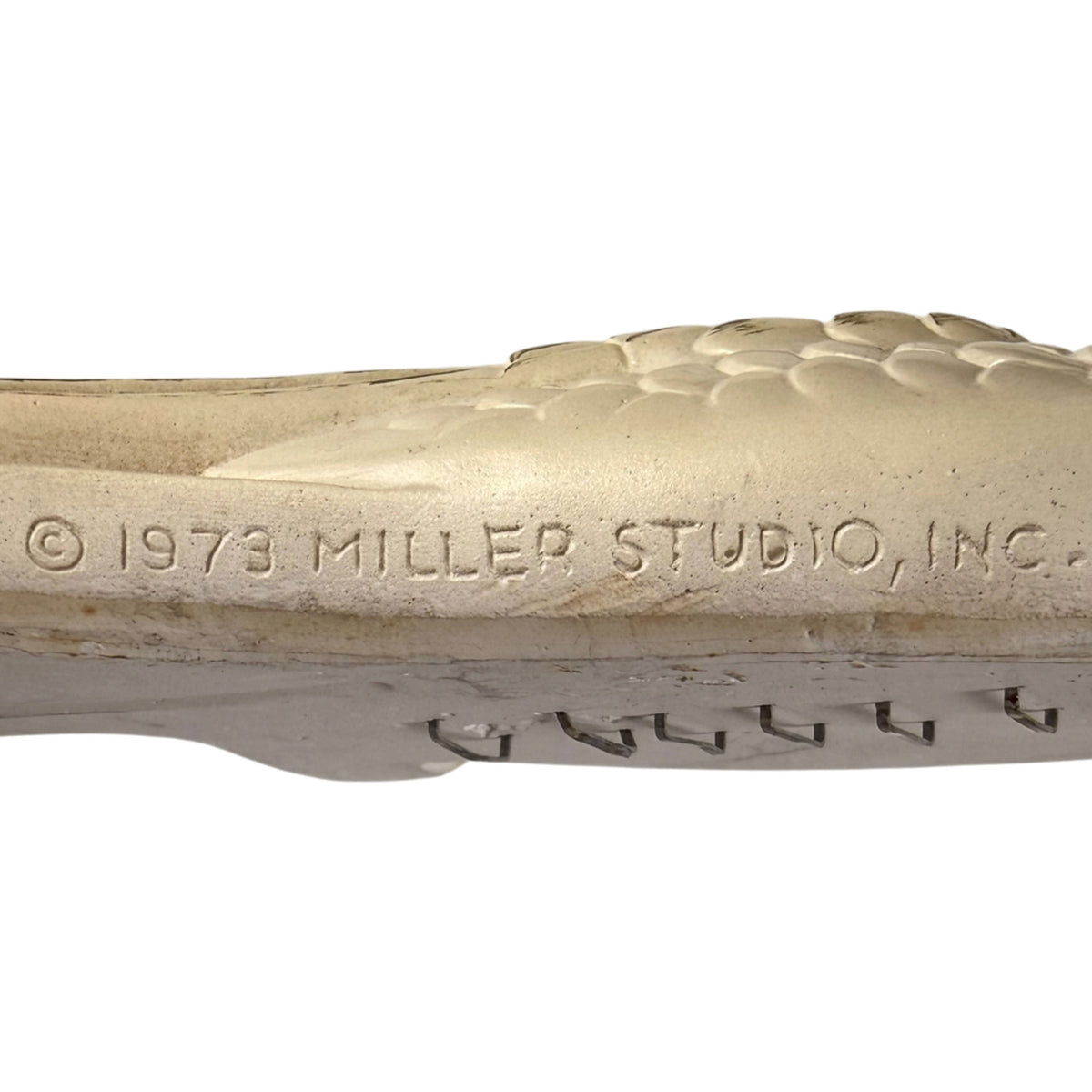 Impressed 1973 Miller Studio Inc copyright marking on vintage chalkware cockatoo wall plaque