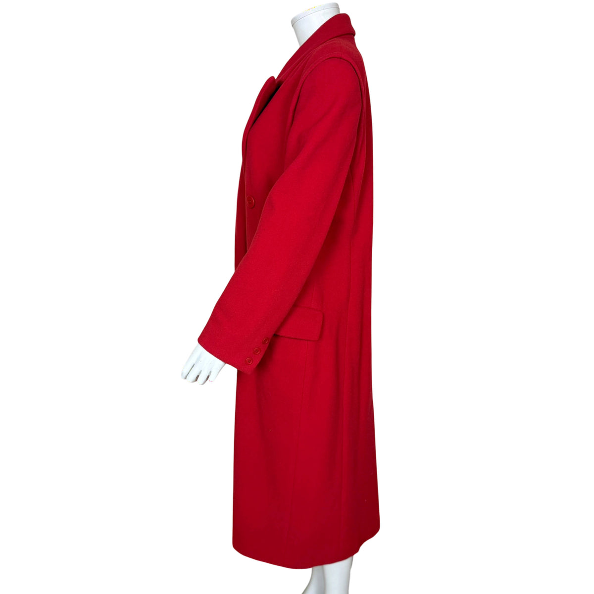 Side profile of Mondi red wool blend coat showing long tailored sleeve, buttoned cuff and straight silhouette.