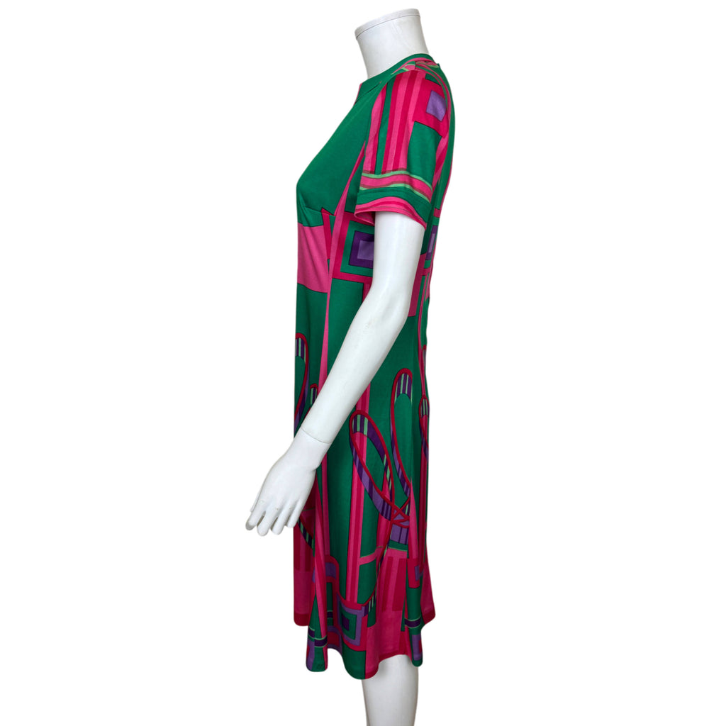 Side profile of vintage Swiss Montreux Knitting jersey dress showing short sleeve and softly flared silhouette