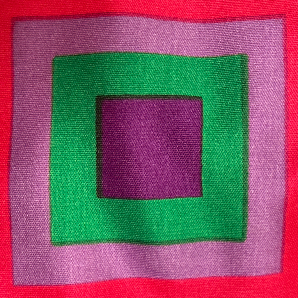 Close-up of concentric square geometric print in purple, green and pink on vintage Montreux Knitting jersey