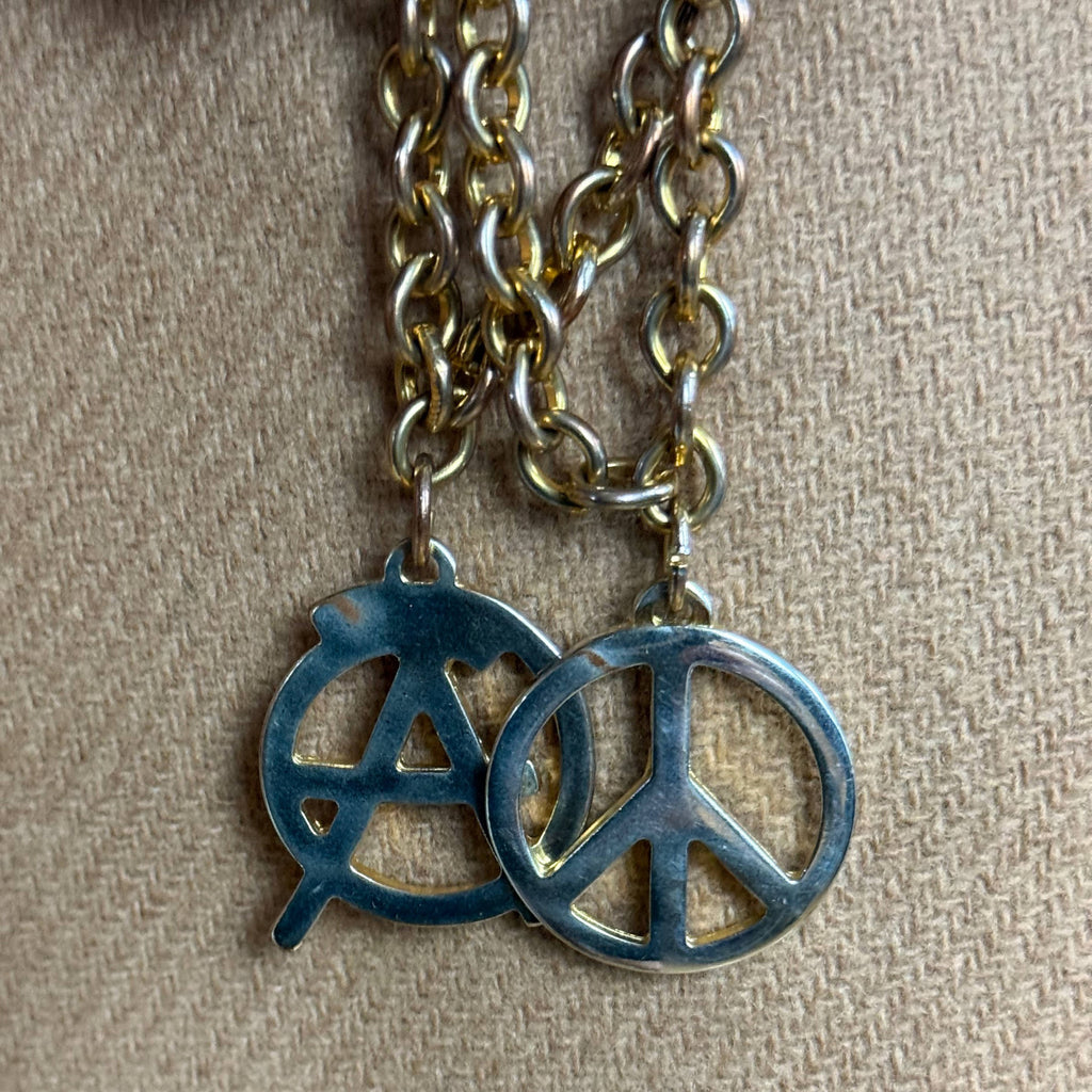 anarchy and peace symbols on Moschino coat