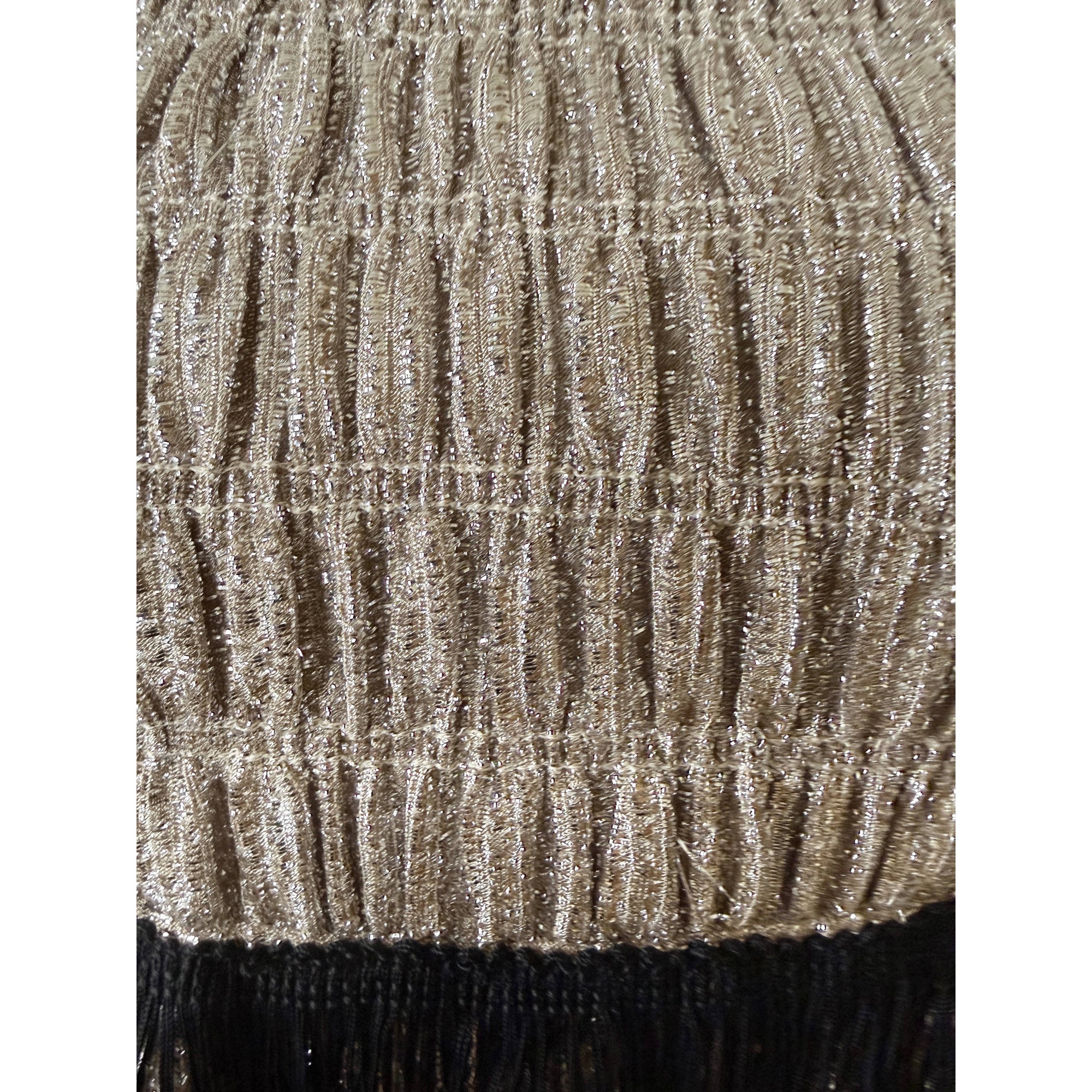 close up of metallic ruched fabric on 60s dress