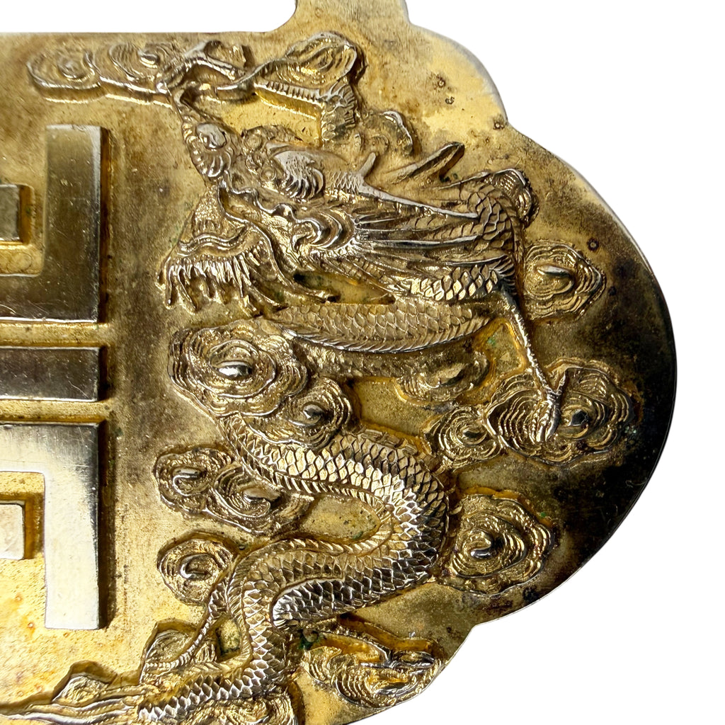 Close-up of repoussé dragon decoration on Chinese export silver piece