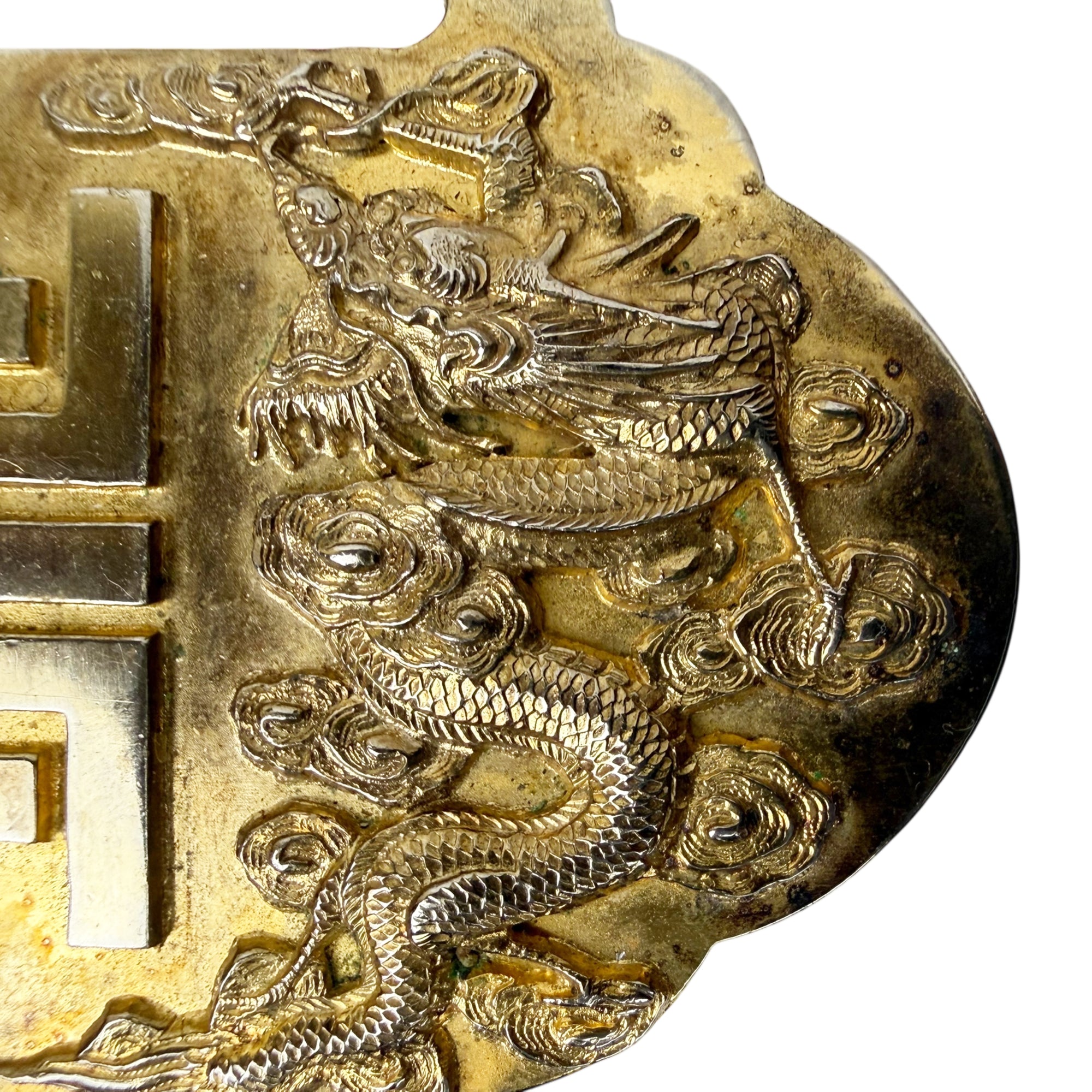 Close-up of repoussé dragon decoration on Chinese export silver piece