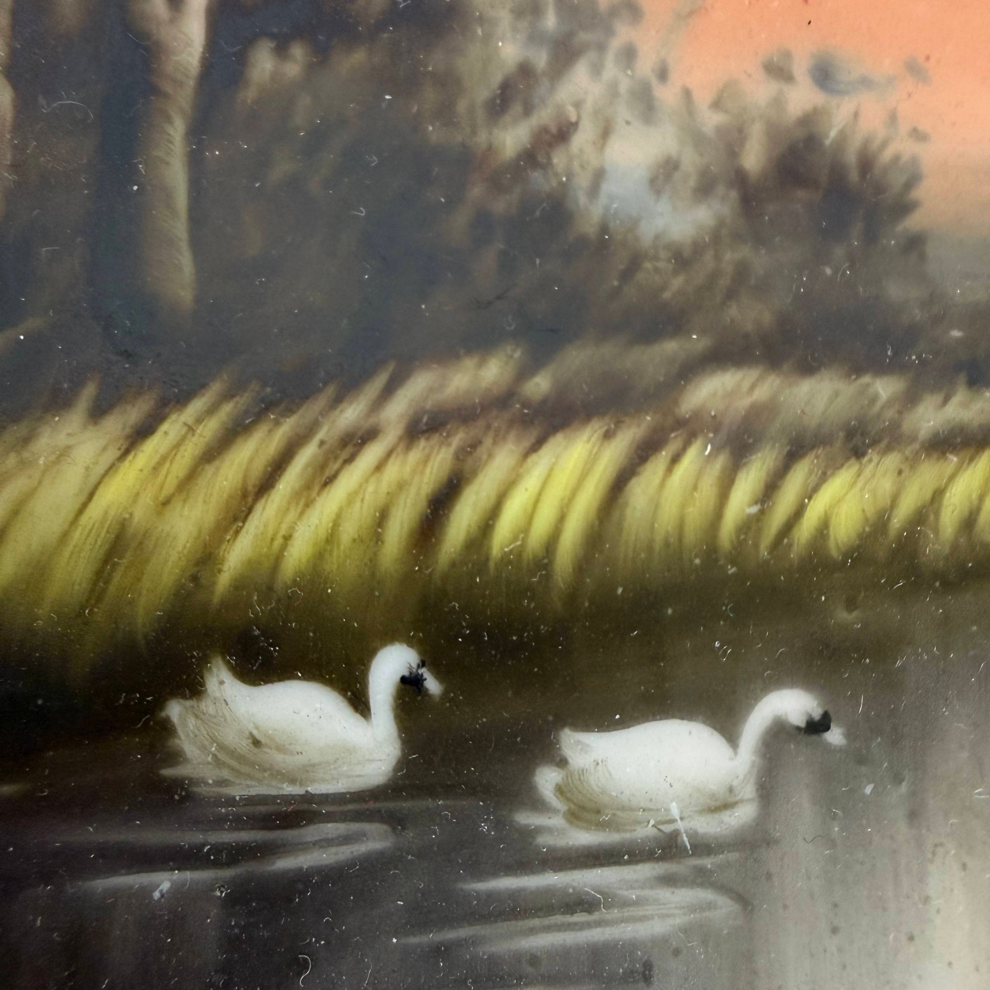 Detail of hand painted white swans on Noritake plate