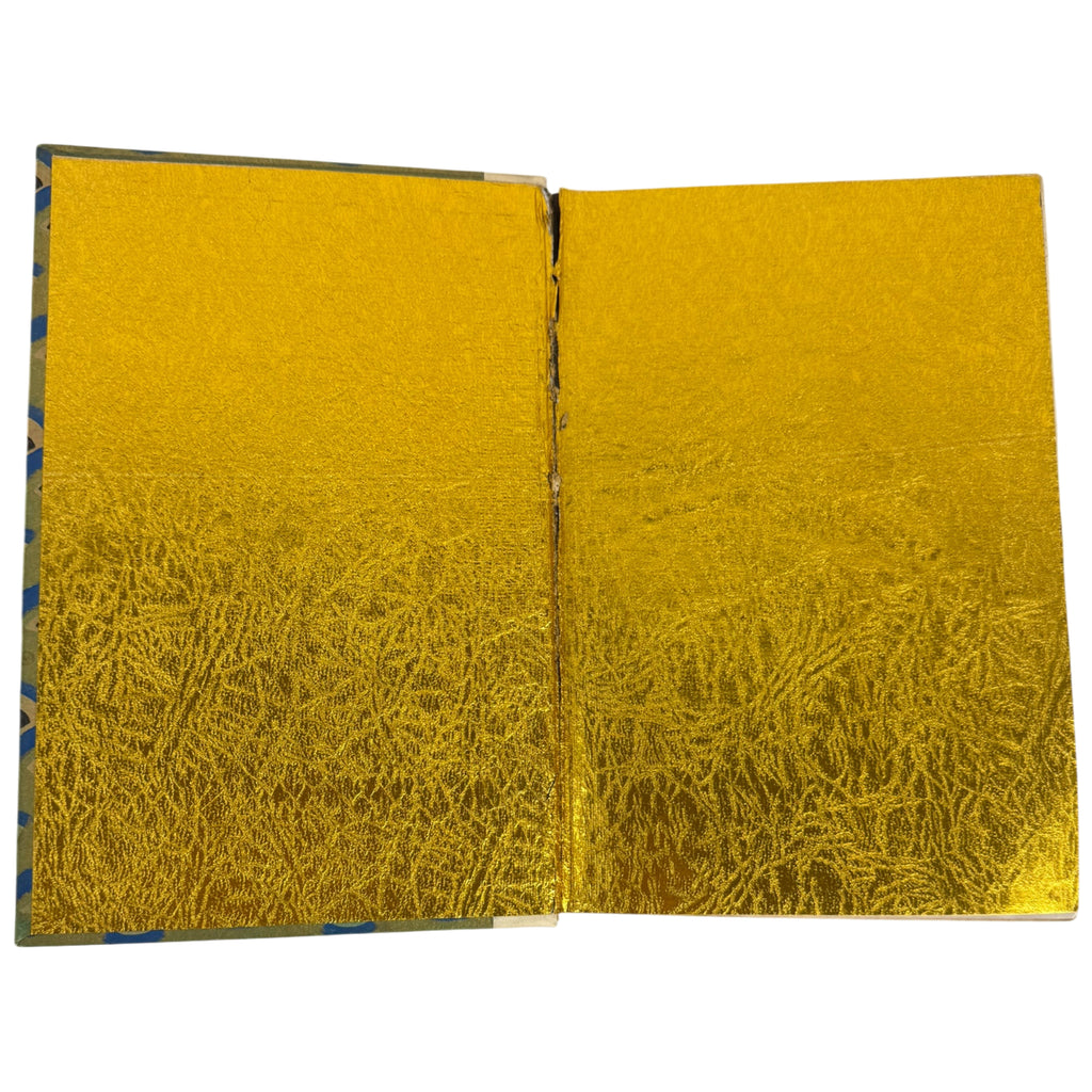 peacock's feather book with textured gold pages