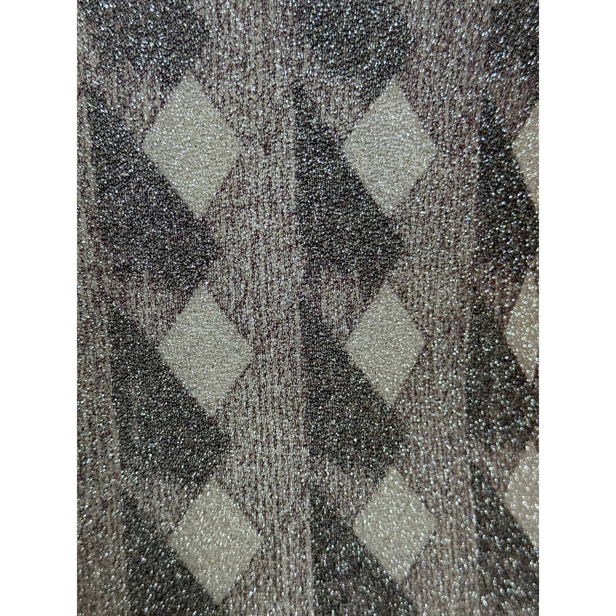 Pelilla sheer metallic fabric close-up showing shimmering geometric hand printed pattern