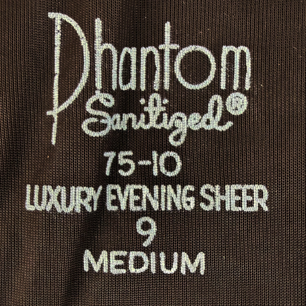 Close-up of a dark brown sheer nylon stocking stamping reading 'Phantom Sanitized 75-10 Luxury Evening Sheer 9 Medium' in white .