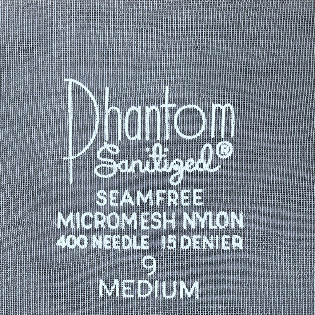Close-up of a silver blue nylon stocking  text reading 'Phantom Sanitized Seamfree Micromesh Nylon 400 Needle 15 Denier 9 Medium'.