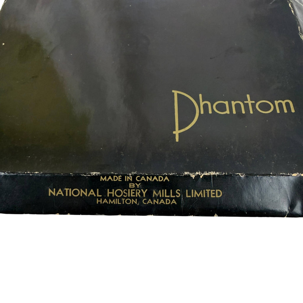 A close-up of a vintage black nylon stockings box with gold lettering. The word 'Phantom' is printed prominently in gold script, with 'Made in Canada by National Hosiery Mills Limited Hamilton, Canada' printed in smaller gold text along the bottom edge.