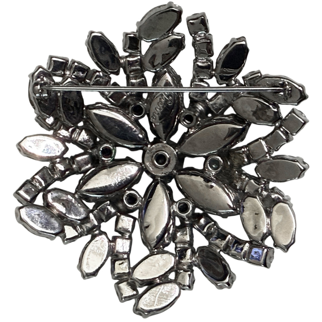 Reverse of vintage Pierre rhinestone brooch showing pin and metal setting