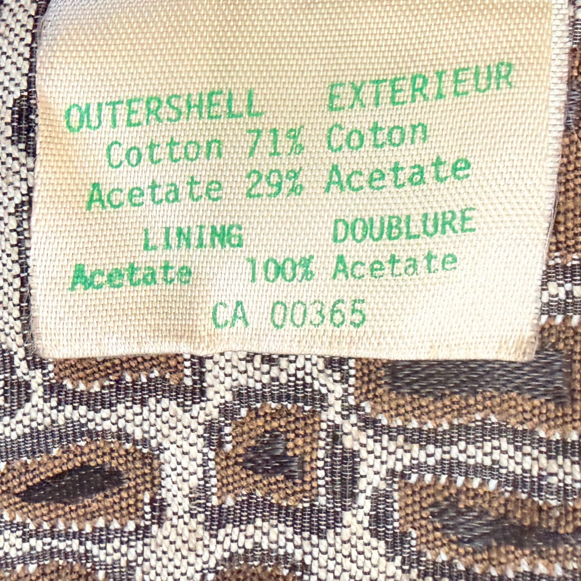 Content label on vintage 70s french couture fabric coat