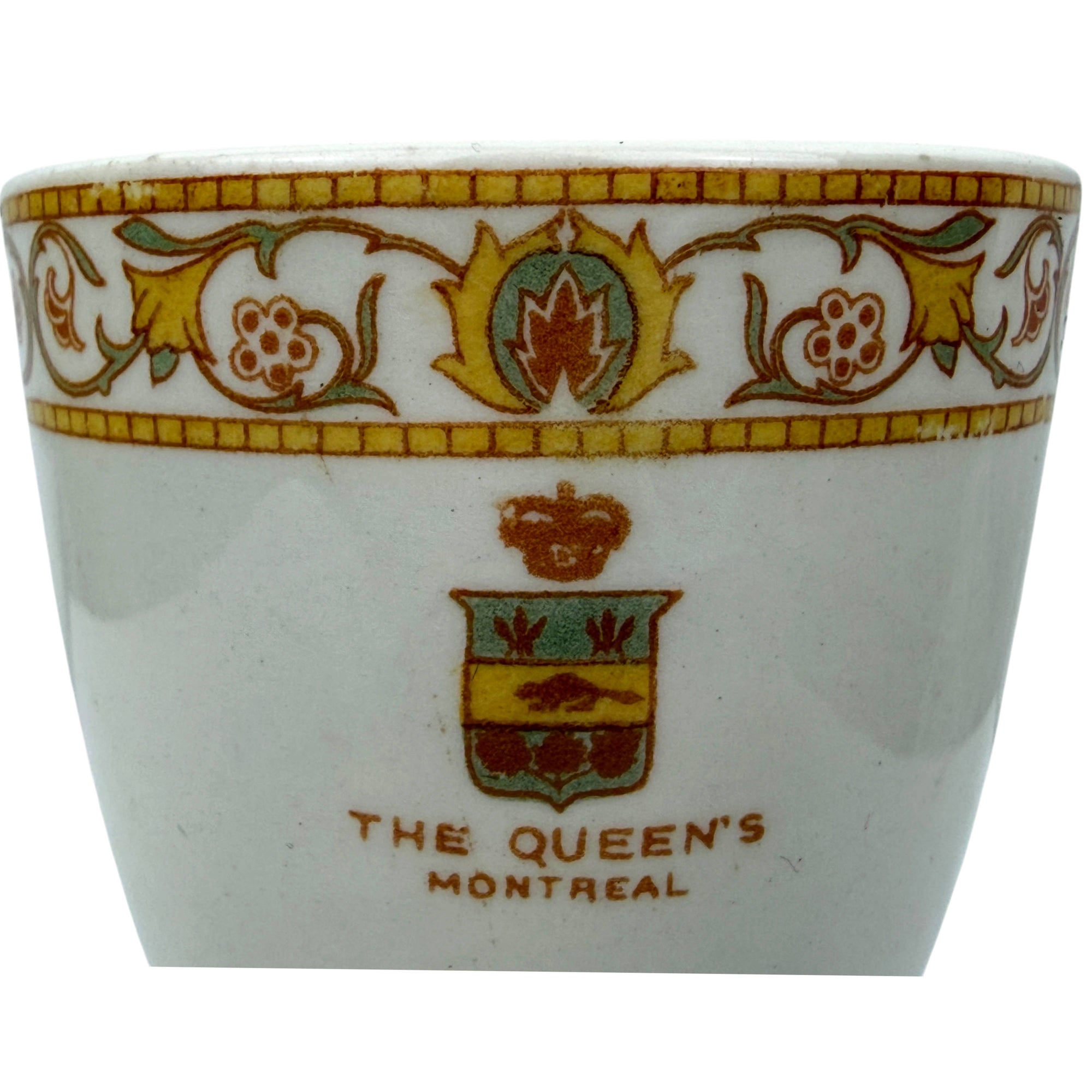 close up of The Queen's Hotel logo on egg cup