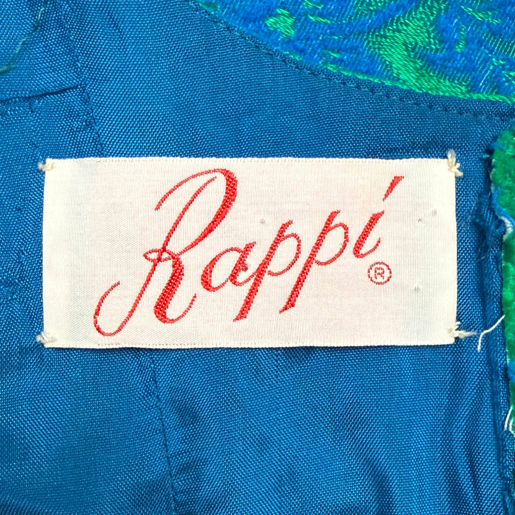 Original Rappi designer label in red script sewn into blue lining of vintage cocktail dress
