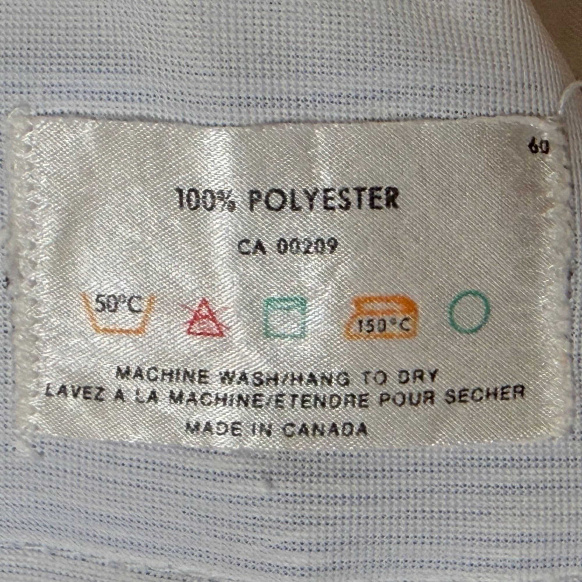 Riviera 100% polyester Made in Canada care label