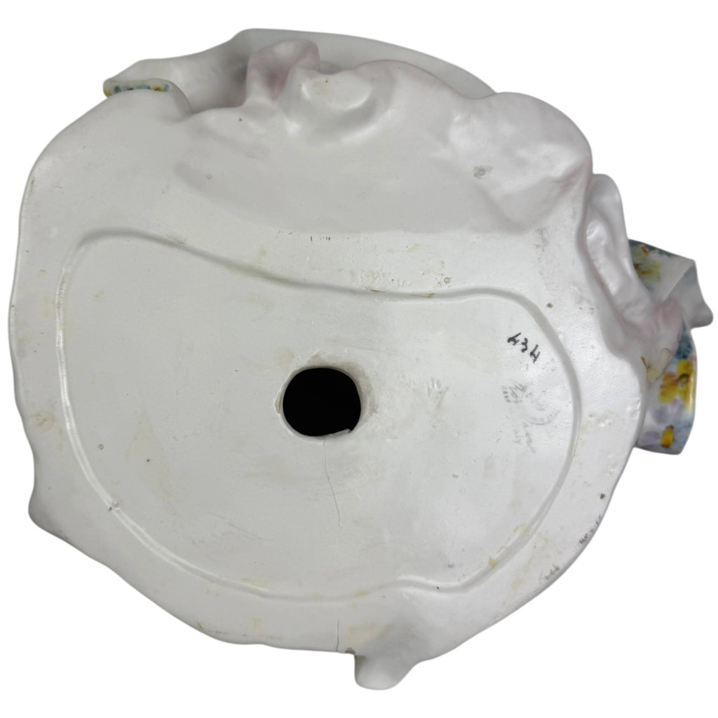 underside of figurine