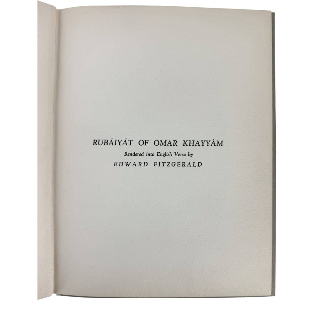 An open book showing a title page with the text 'RUBĀIYĀT OF OMAR KHAYYĀM', 'Rendered into English Verse by', and 'EDWARD FITZGERALD' printed in black serif font on an off-white page.