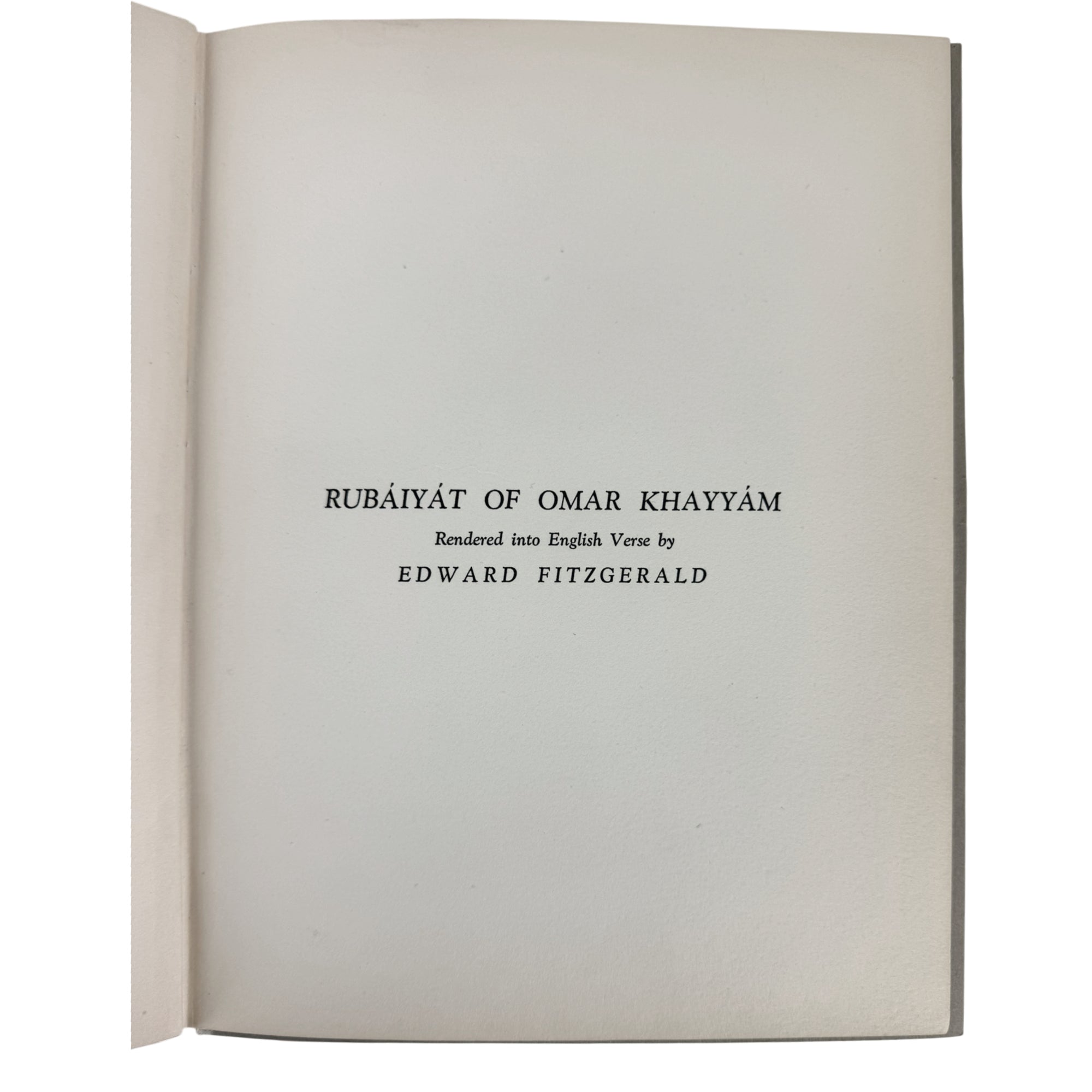 An open book showing a title page with the text 'RUBĀIYĀT OF OMAR KHAYYĀM', 'Rendered into English Verse by', and 'EDWARD FITZGERALD' printed in black serif font on an off-white page.