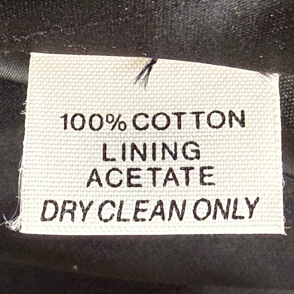 Saks Fifth Avenue smoking jacket label showing 100% cotton and acetate lining