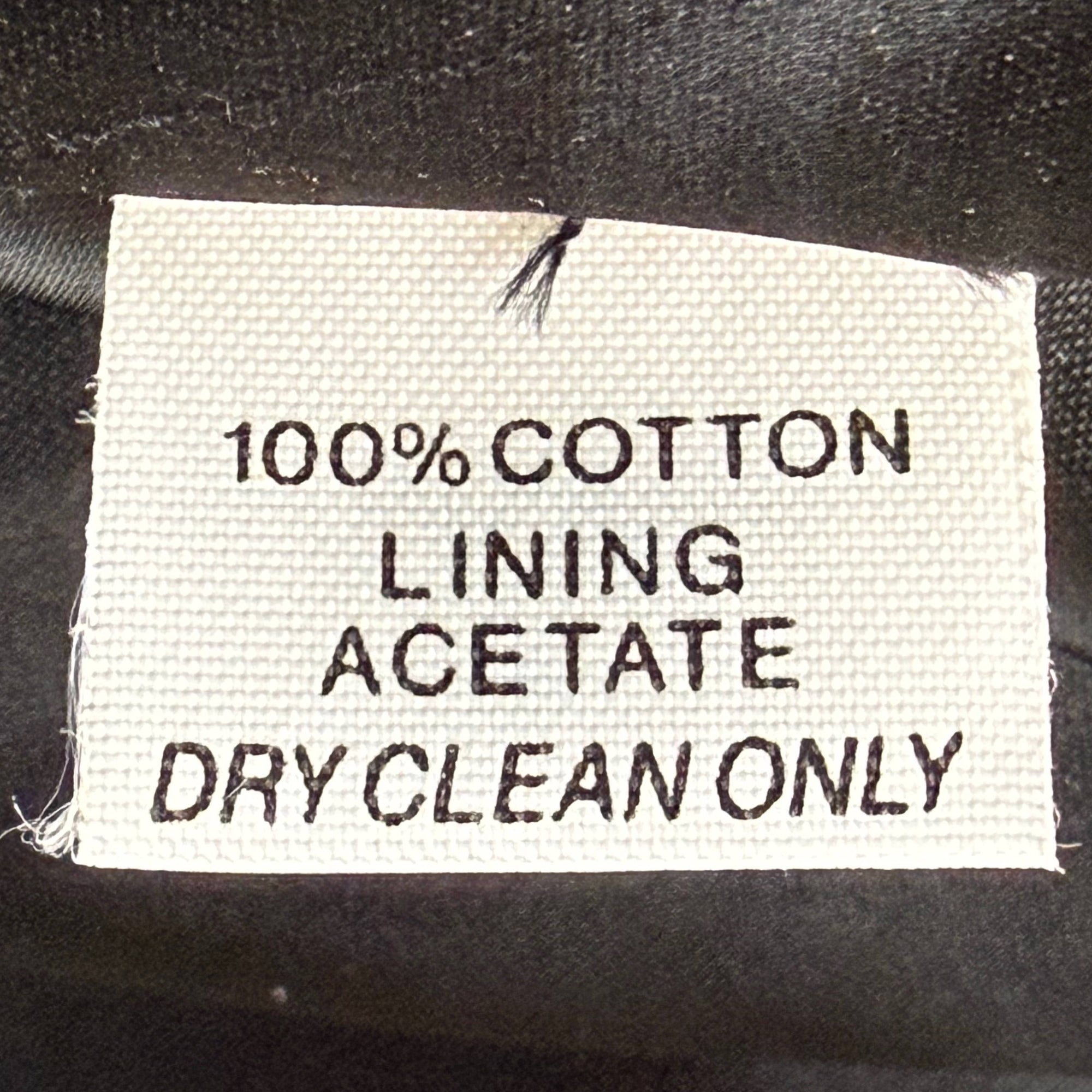 Saks Fifth Avenue smoking jacket label showing 100% cotton and acetate lining