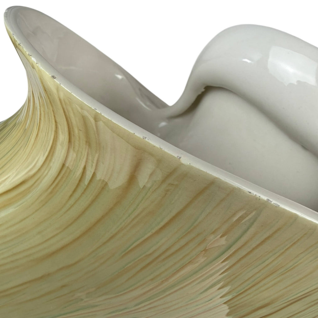 detail of shell form texture and fleabite damage on mid century italian ceramic centrepiece vase
