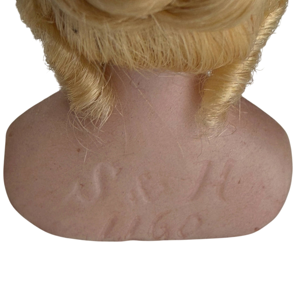 Close-up of impressed Simon and Halbig S and H 1160 markings on back of antique German bisque doll bust