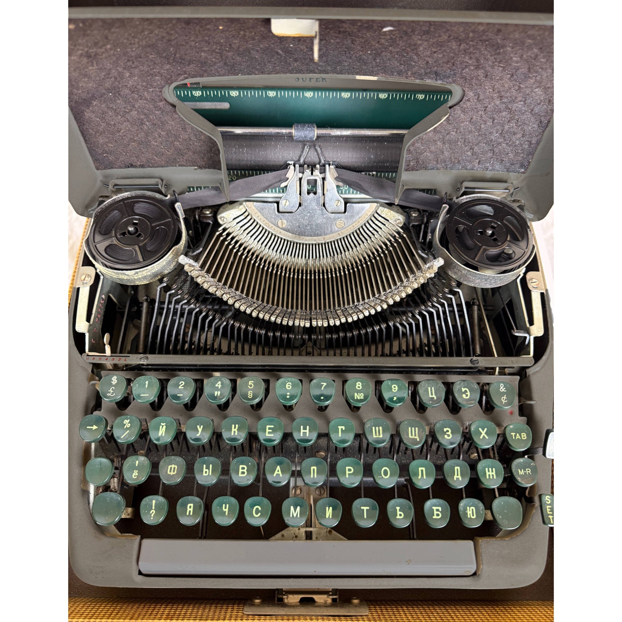 Smith-Corona Super with cover open showing typebars and ribbon