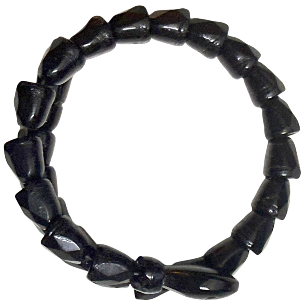 Overhead view of Victorian black jet serpent bracelet showing circular double-coil construction