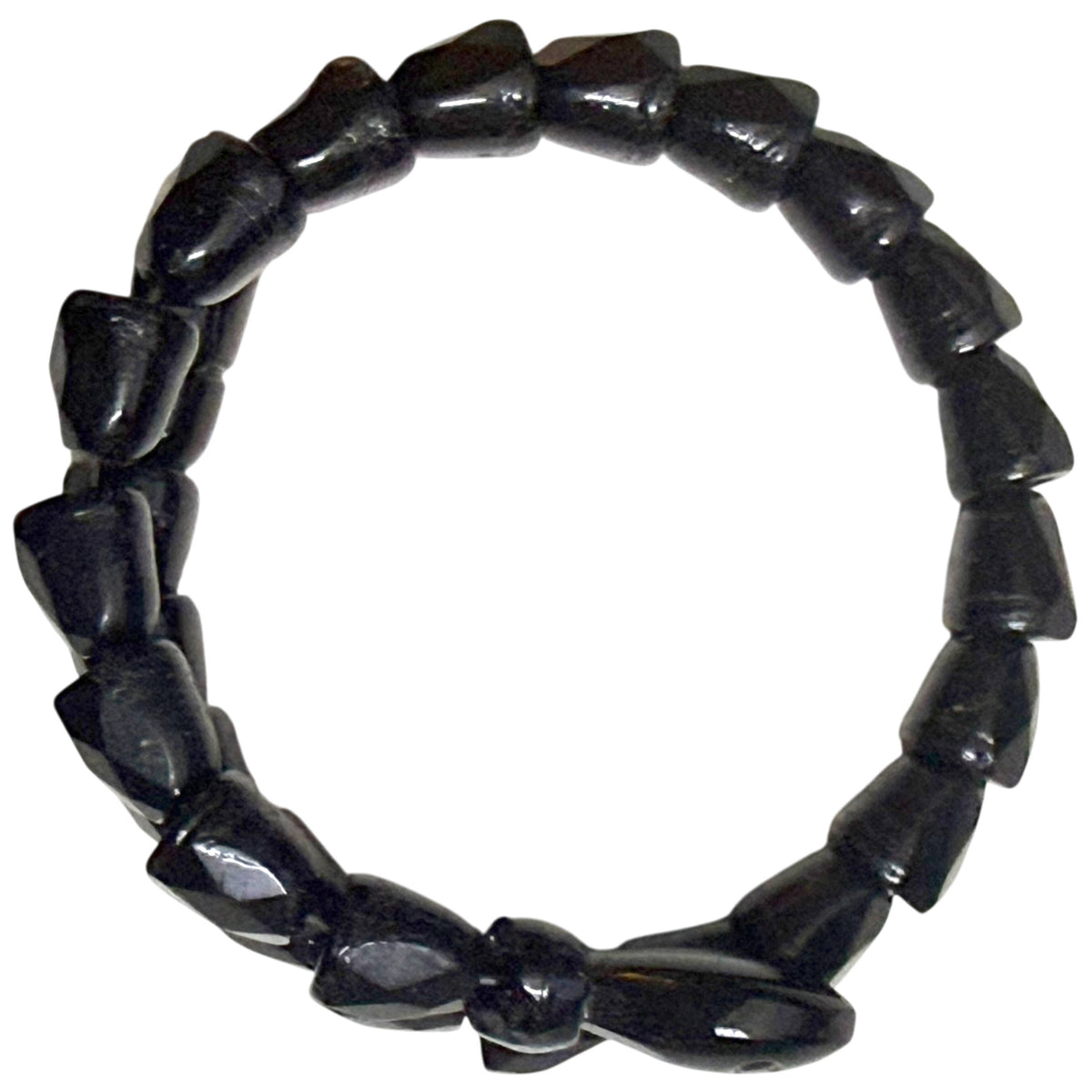 Overhead view of Victorian black jet serpent bracelet showing circular double-coil construction