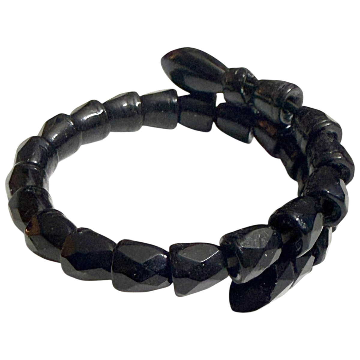 Side view of antique Victorian snake wrap bracelet showing graduated faceted black beads and flexible coil design