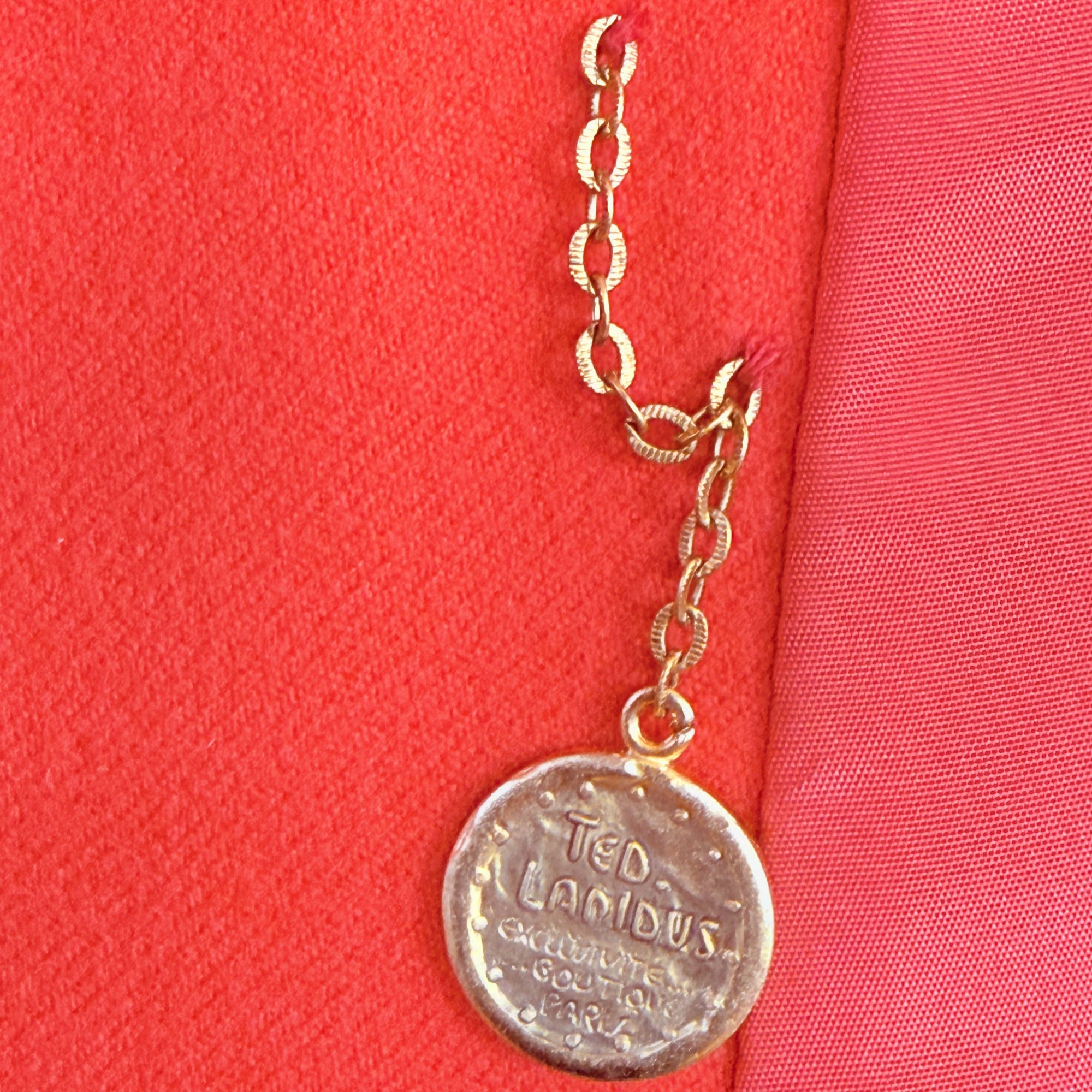 Medallion on vintage 1970s Ted Lapidus Paris red wool belted jacket Exclusive Boutique France