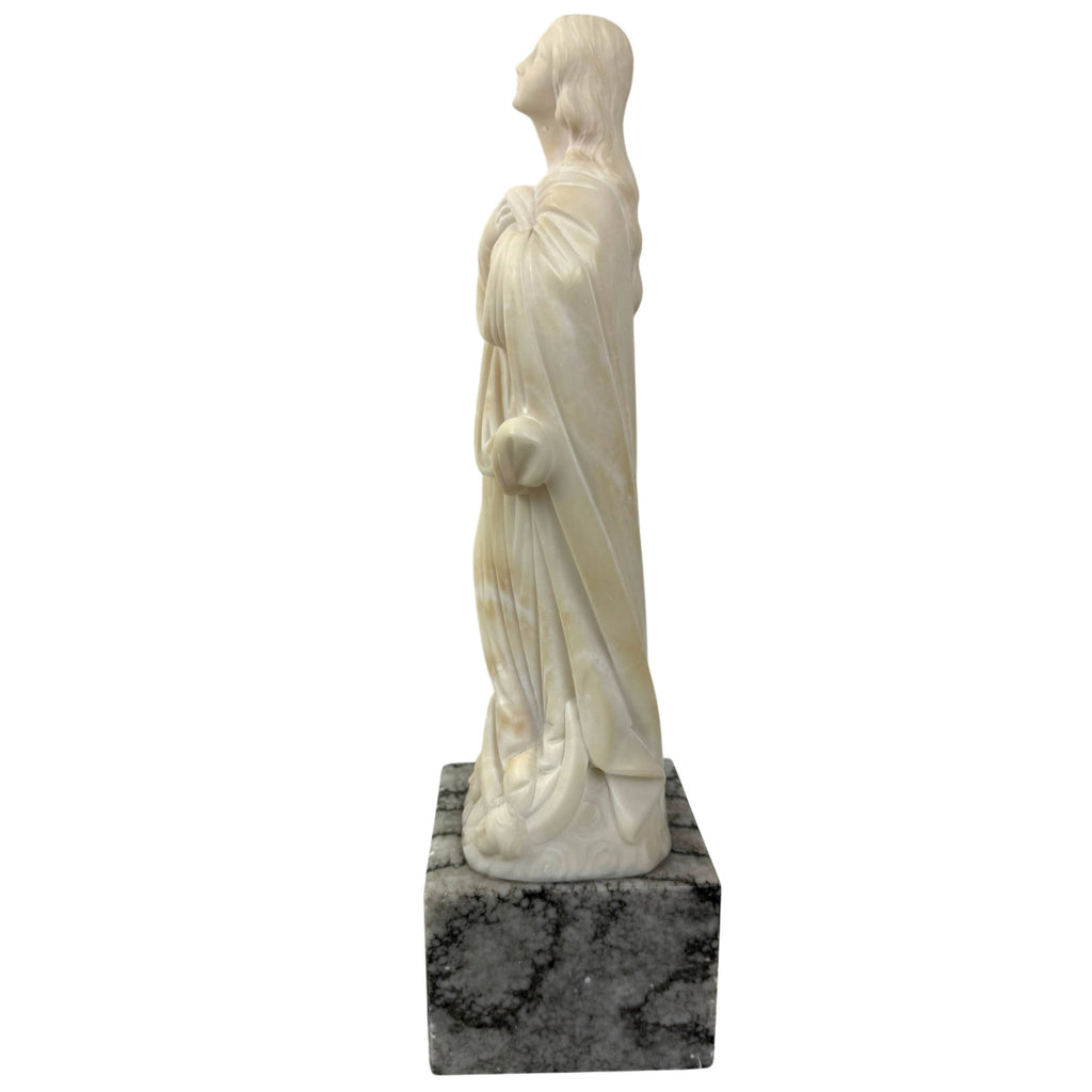 Carved alabaster Madonna figure with marble pedestal