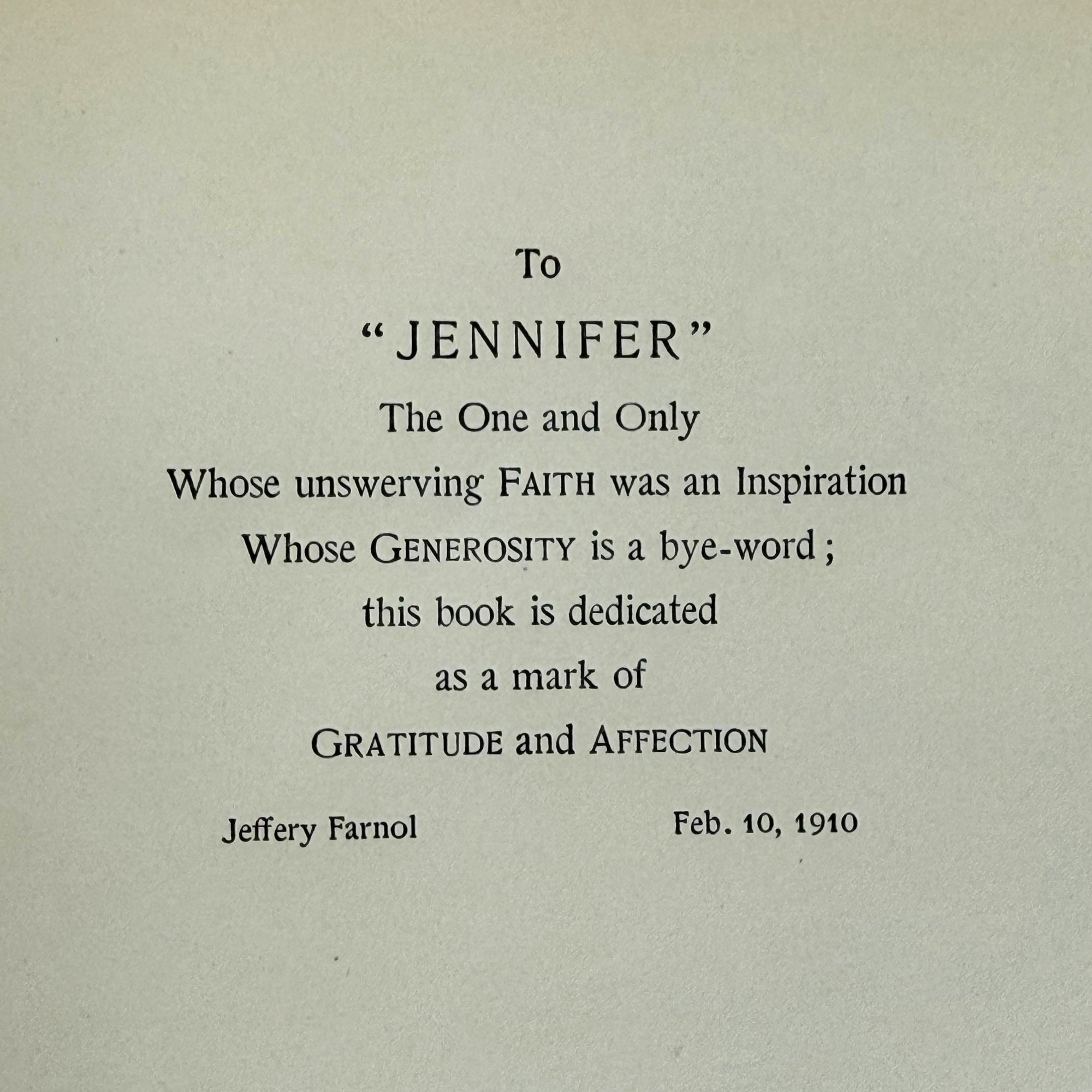 A vintage paper dedication card with black printed text on an off-white background, addressed to 'JENNIFER' with a sentimental message and signed by Jeffery Farnol on Feb. 10, 1910.