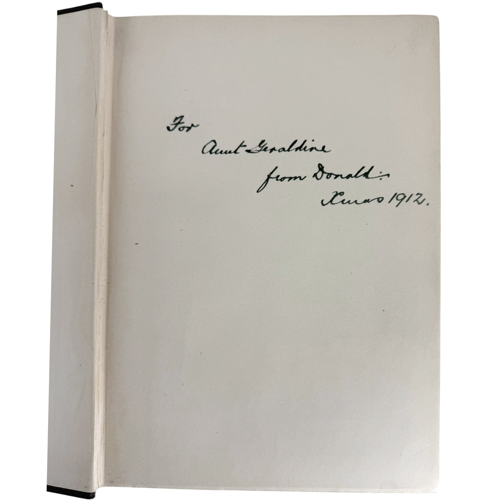 A vintage off-white book or notebook shown open, with handwritten black ink text on the right page. The spine is visible on the left, and the pages are photographed against a plain white background.