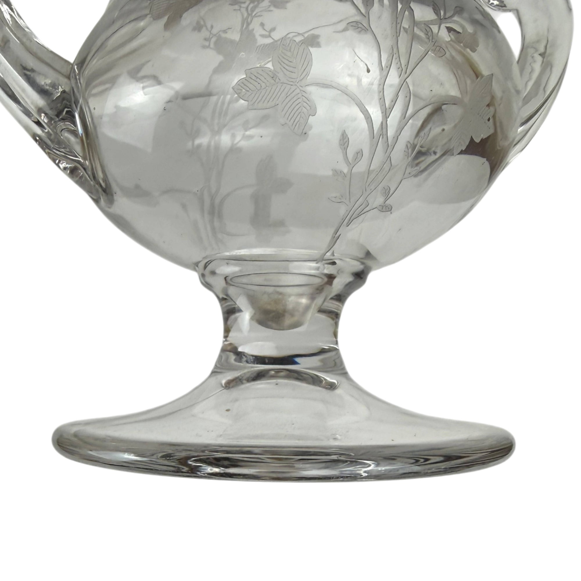 side of foot of etched glass vase