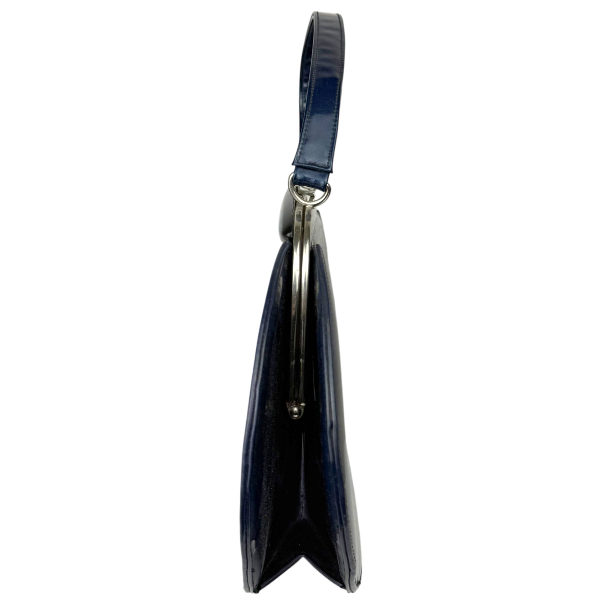 Vintage 1950s Tudor Bag patent leather handbag side view showing structured frame and depth