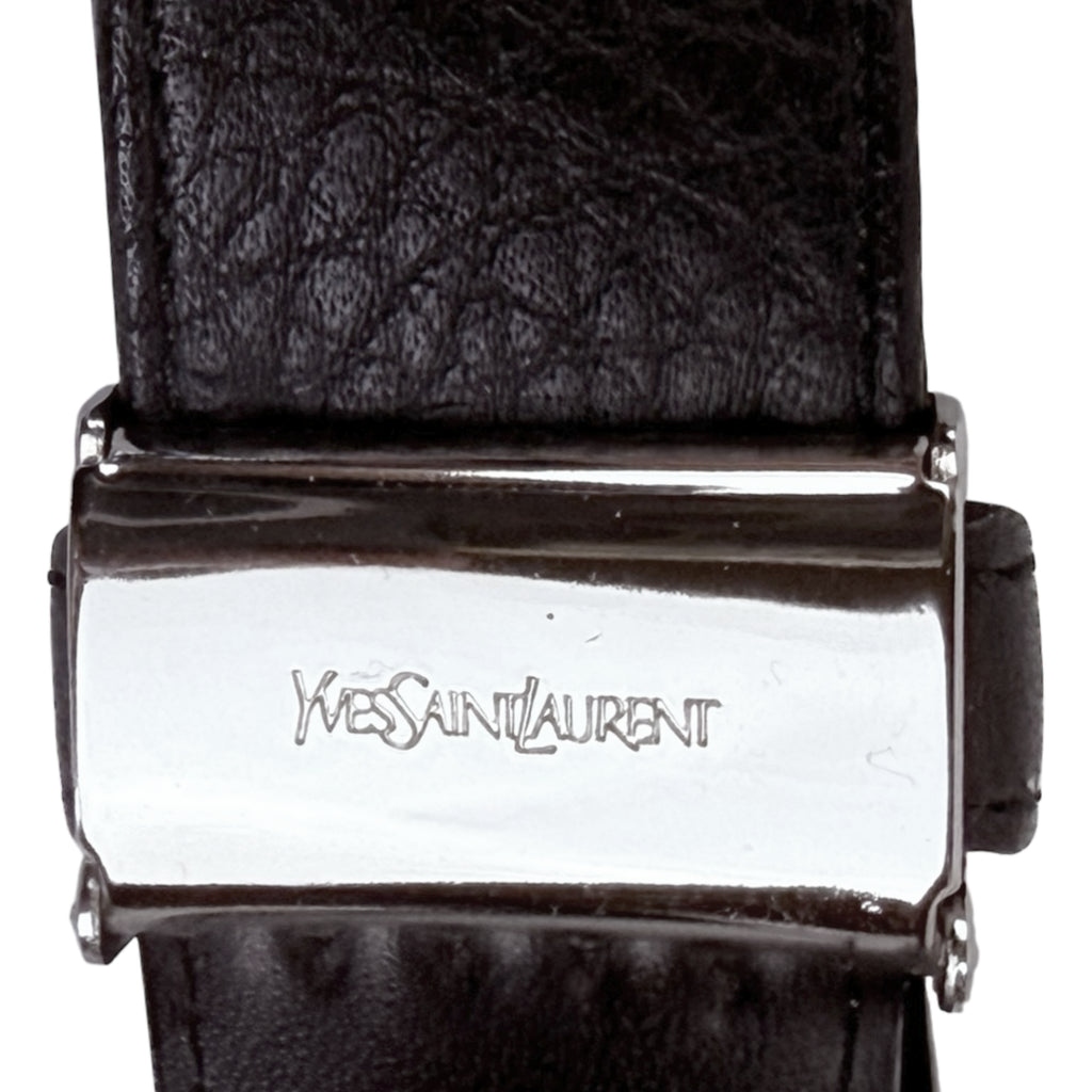 Close up Yves Saint Laurent stamp on belt buckle ratchet