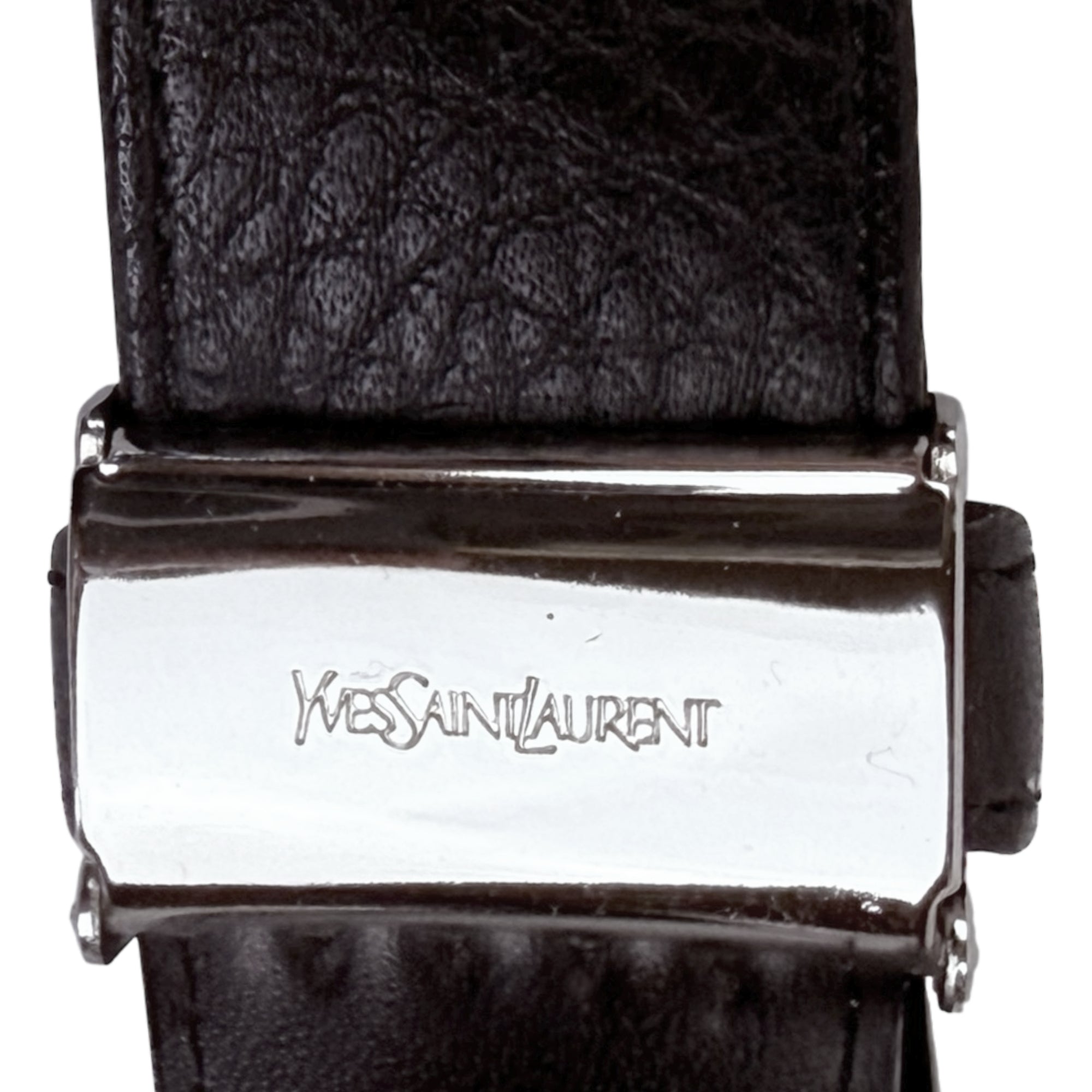 Close up Yves Saint Laurent stamp on belt buckle ratchet