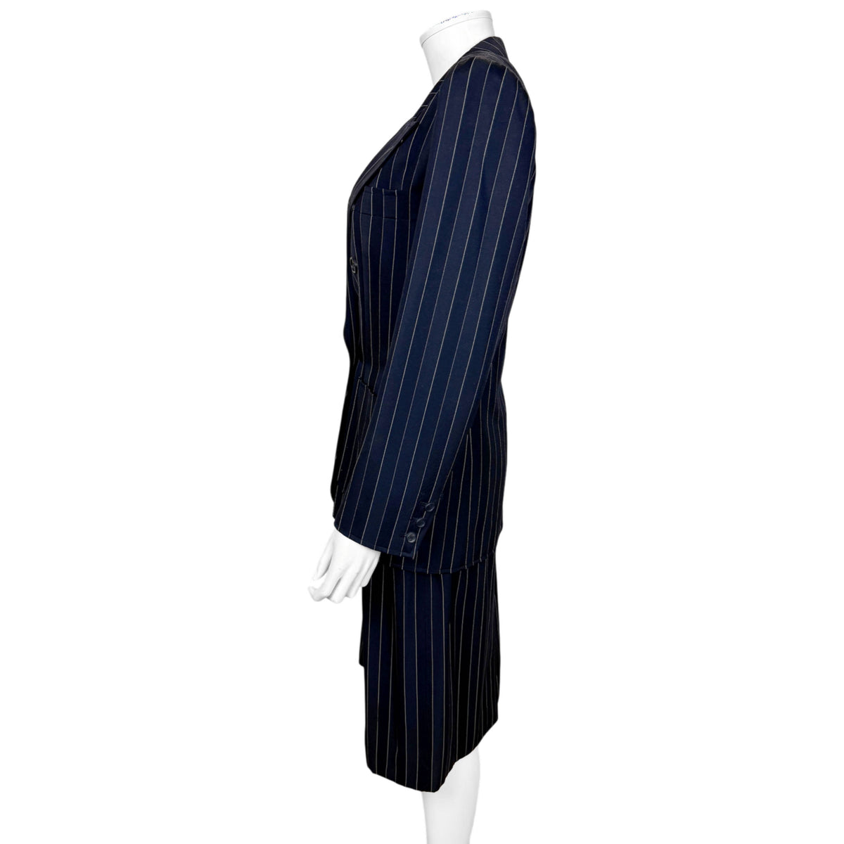 Side view of Yves Saint Laurent Rive Gauche pinstripe skirt suit showing tailored jacket silhouette